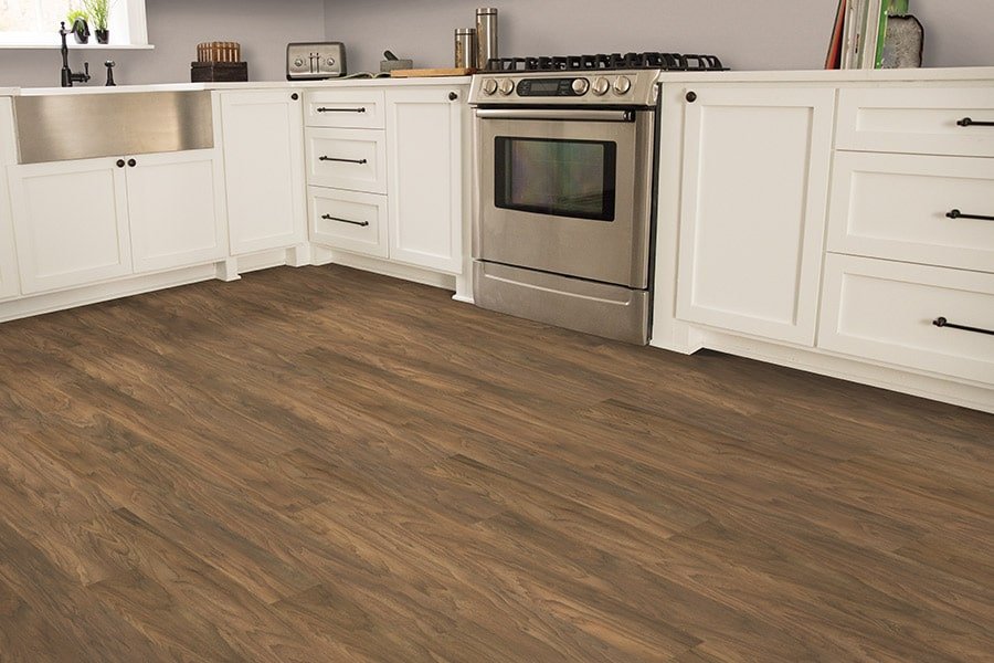 Rustic kitchen with white cabinets and waterproof wood flooring
